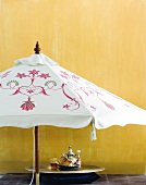 Oriental style souvenirs below an umbrella