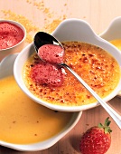 Close-up of creme brulee with strawberry and amaretto foam in bowl