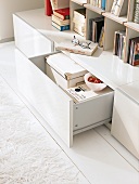 Bookshelf with open lowboard open drawer in white