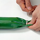 Thicken rice stuffed in banana leaves, step 2