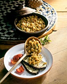 Seasoned rice, eggplant and tomatoes on plate