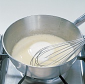 Cream being added in mixture, step 9