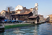 View of houses and church beside canal, Venice, Italy