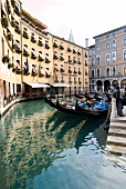 View of facades and gondolas moored in canal, Venice, Italy