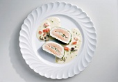 Salmon roulade with oyster cream on plate
