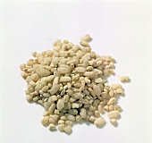 Close-up of broken rice on white background