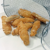 Fried roach fish fillets on paper and fryer, step 4