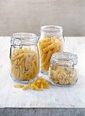 Different types of pasta in glass jar