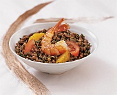 Lentil salad with oranges, tomato and shrimp in bowl