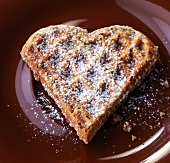 Close-up of chocolate waffles with icing sugar