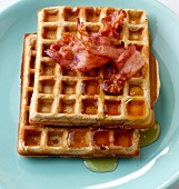 American waffles with bacon on plate