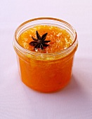 Carrot jam with kumquats in glass jar