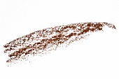 Close-up of drawn lines with brown eyeliner on white background