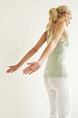 Blonde woman in sportswear performing cardio pilates to strengthen the body and burn fats