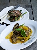 Veal escalope with marsala and lamb saltimbocca on two plates