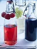 Two bottles of raspberry and red wine vinegars