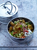 Indian chickpeas and bread salad in pot