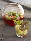 Two glass vessels with mojito and mojito punch