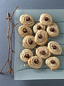 Banana dumplings with lemon icing on glass plate