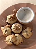 Close-up of almond and raisin biscuits with walnut and plum biscuits on plate