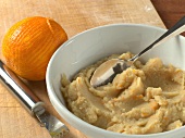 Close-up of chestnuts and orange in bowl for preparation of biscuits, step 2