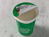 Sour cream in disposable cup