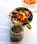 Pasta salad with apple and radicchio in cup and marinated lax in jar