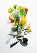 Zucchini, oil, flowers, pumpkins and garlic on cutting board