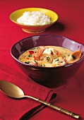 Brazilian fish stew with rice and shrimp in bowl