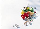 Oil, herbs, cheese, tomatoes and other ingredients on white background