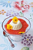 Eggnog mousse and yellow pansy flowers in dessert