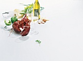 Lobster, wine, wine glasses and other ingredients on white background