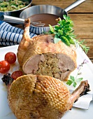 Close-up of boiled goose with grains and vegetables in pot