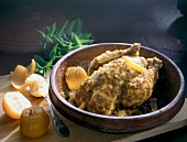 Close-up of spiced lemon chicken in clay bowl