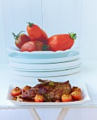 Roast lamb with tomates provencales