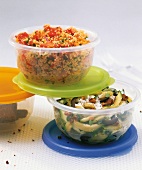 Couscous vegetables and zucchini sticks with nuts in box