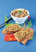 Bread slice with tomato and basil cream on it and mushroom spread in bowl