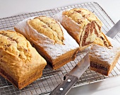 Three marble cake on grid with knife