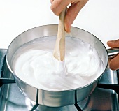 Close-up of fondant being heated in pan, step 1