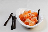 Close-up of carrots with sweet and sour dip in bowl