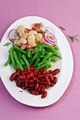 Close-up of green beans and kidney beans on dish