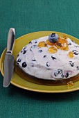 Blueberries in white wine jelly on plate