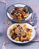 Two dishes with marinated dried fruit and fruit compote with couscous