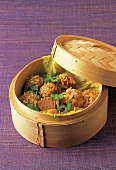 Rice balls with meat and Chinese cabbage in steaming basket