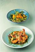 Monkfish with green onions in bowl and shrimp in caramel sauce on plate