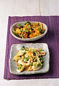 Seafood with turmeric and leeks in bowl and squid with chilli on plate