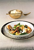 Chicken breast garnished with yogurt and bay leaves on plate