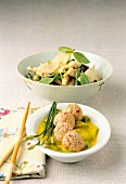Pear and bean salad, curry with almond meatballs in bowls