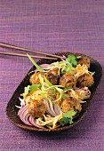 Meatballs with a cabbage salad and red onions (Asia)