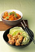 Tomatoes with coconut fish and marinated fish with Asian guacamole in bowls